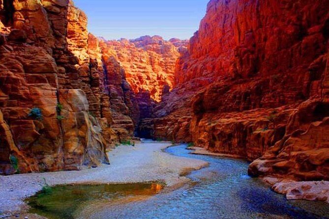 Wadi Mujib Siq Trail Hiking Experience from Dead Sea - Entering the Siq: canyon walls, dam walkway, and the sense of real depth